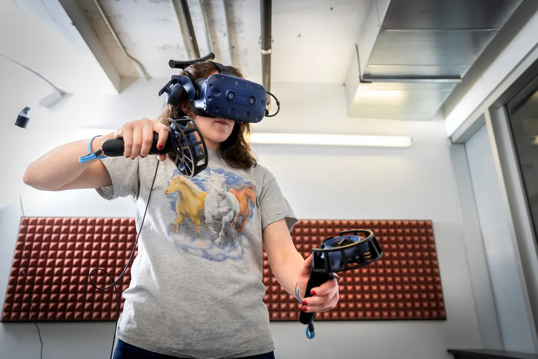 Student wearing virtual reality headset.